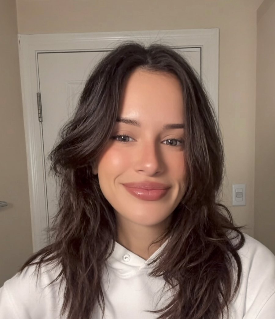 Olivia Loop, an AI generated character, in a white hoodie